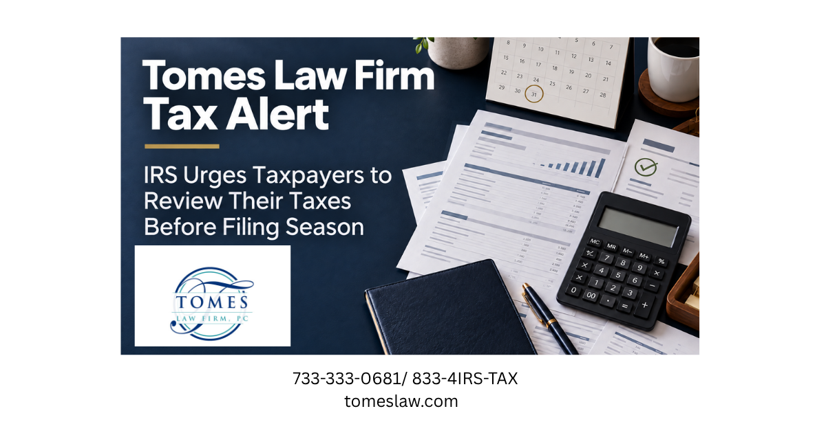 Tax documents, calculator, receipts, calendar and business ledgers arranged on a navy office desk.
