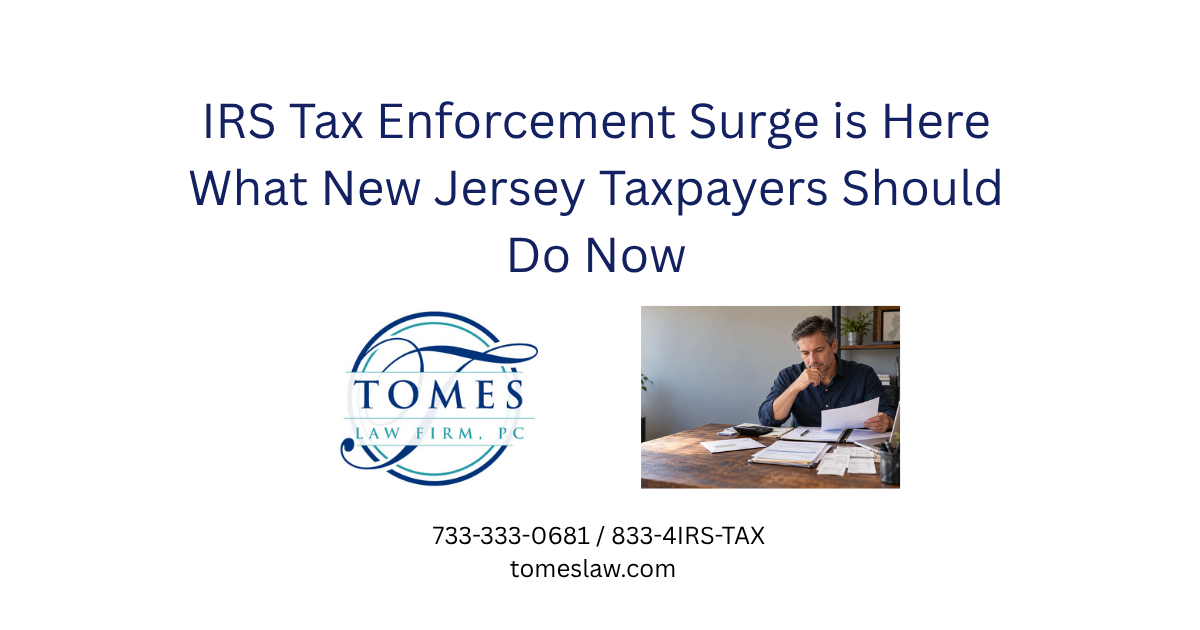 Small-business owner reviewing financial records and tax documents after discovering a possible IRS reporting problem.