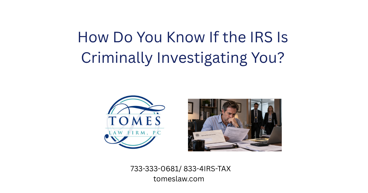 Worried businessman reviewing IRS tax documents as two federal investigators approach his office.