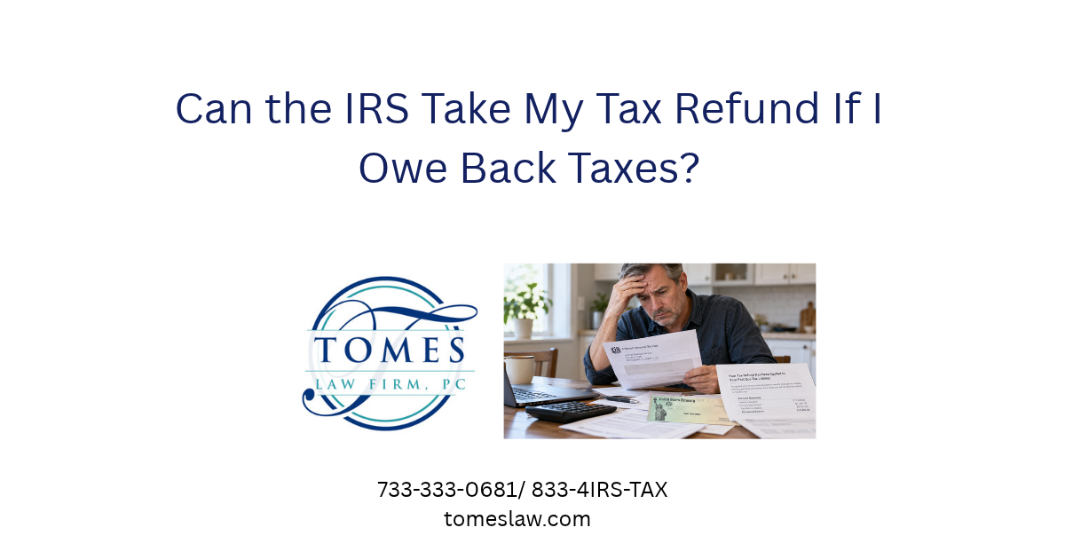 Worried taxpayer reviewing an IRS notice after his tax refund was applied to unpaid back taxes.